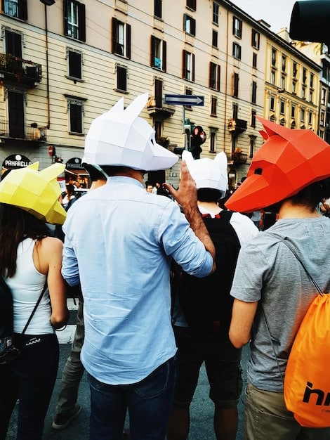 A bustling construction site in a major US city, showcasing workers engaged in various tasks, indicating job creation in the construction sector. Include diverse groups of workers to reflect inclusivity in the workforce.