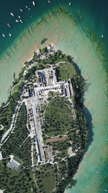 Satellite image showing a Chinese military base built on a reclaimed island in the South China Sea, complete with runways, port facilities, and radar installations.