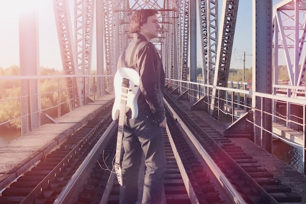 A close-up of a construction worker using advanced equipment to repair a section of a bridge, symbolizing the hands-on effort involved in modernizing transportation infrastructure.