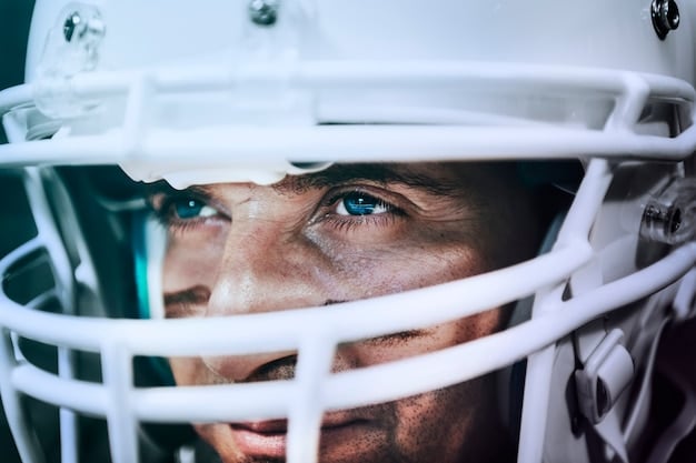 A close-up of an NFL player's helmet showing advanced protective technology. The background is blurred, focusing attention on the detailed design and safety features of the helmet.