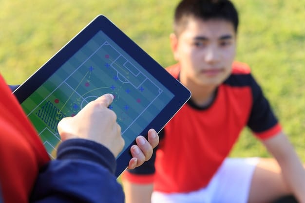 A scout sitting in a stadium, using a tablet to access player data and analytics during a college football game. The tablet screen shows various metrics and performance charts.