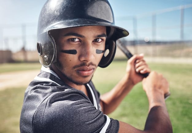 A close-up image of an NFL player wearing a wearable sensor during an offseason training session, highlighting the technology used to track performance metrics and optimize training regimens.
