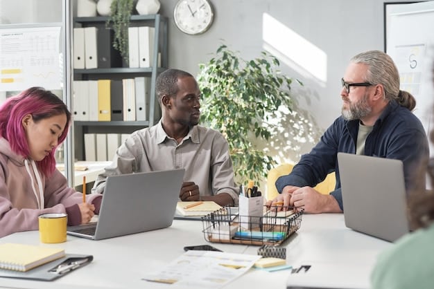 An office setting with people collaborating around a table, brainstorming ideas and working on laptops, representing business growth and strategic planning.