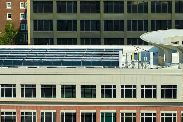 An office building with solar panels on the roof and energy-efficient windows, symbolizing a commitment to sustainable energy practices.