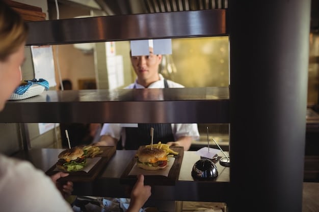 A modern restaurant kitchen showcasing a mix of human staff and automated equipment, such as robotic arms assisting in food preparation or automated dishwashers, to illustrate the integration of technology in response to rising labor costs.