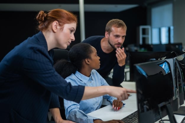 A diverse team of small business employees attending a cybersecurity training session, looking engaged and taking notes, with a presentation slide showing cyber threats.