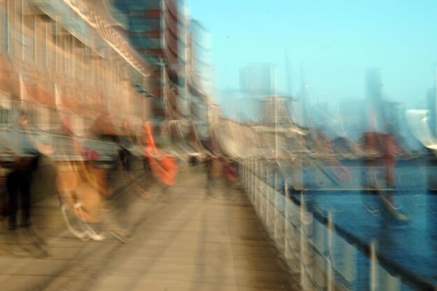 A split image showing a traffic jam of cargo ships on one side (representing supply chain issues) and a crowded shopping mall on the other side (representing high consumer demand).